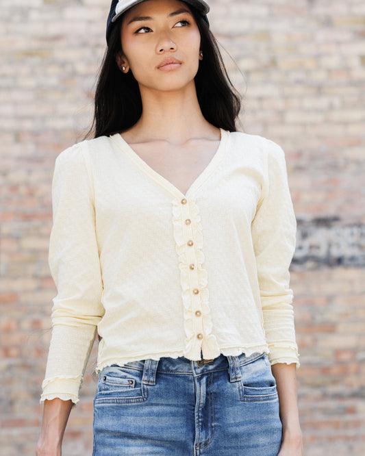 Double cream cardigan with V-neck, long sleeves, button front and ruched hem