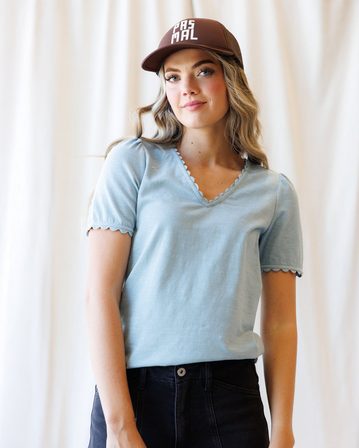 Light blue scallop-edge V-neck tee with short sleeves, close-up front