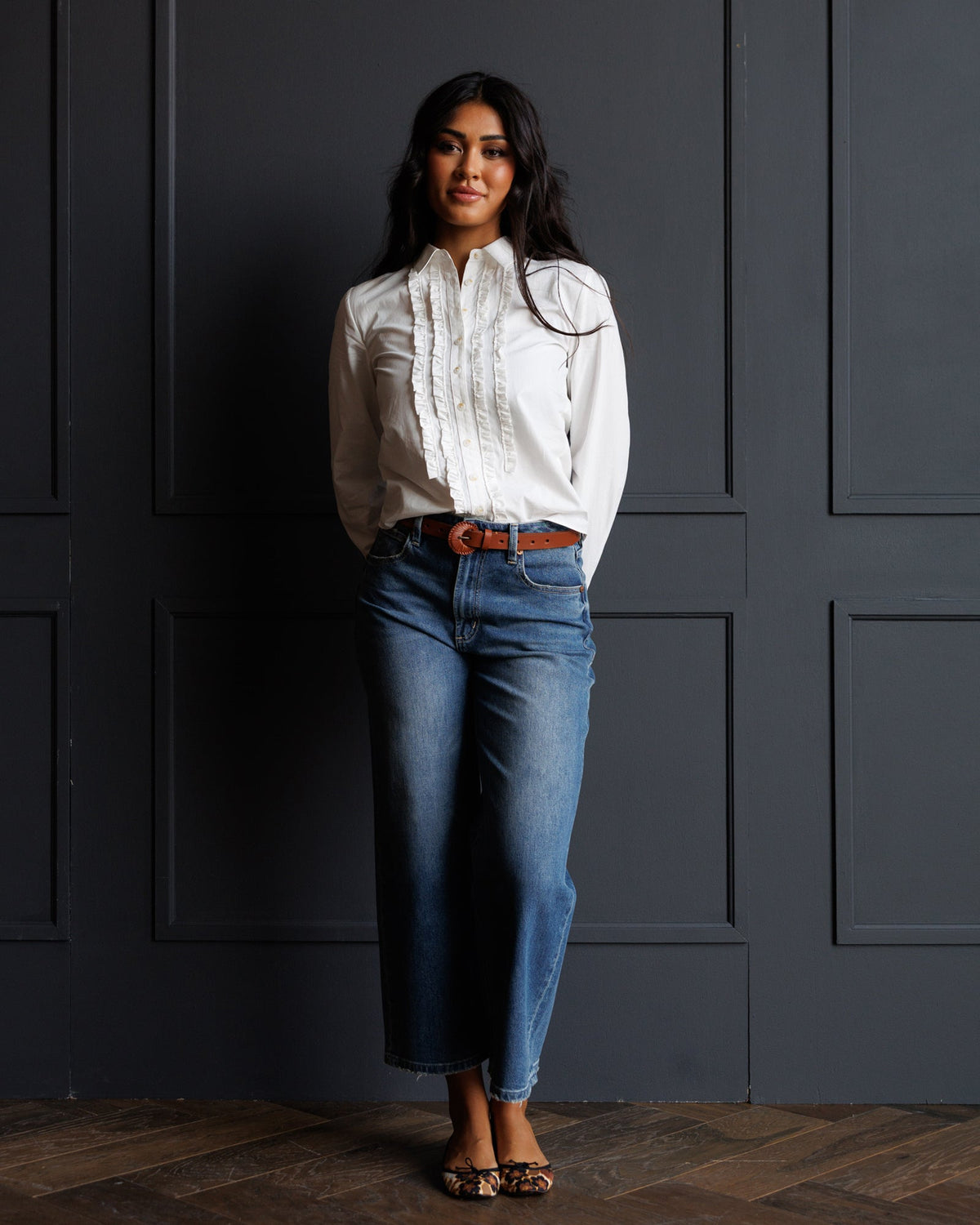 White tuxedo-style button-down shirt with ruffled front and long sleeves
