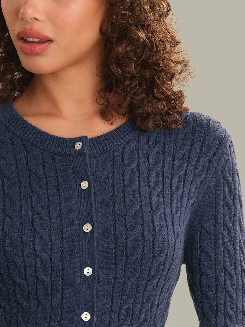 Dark blue cable-knit cardigan neckline with round buttons and ribbed trim