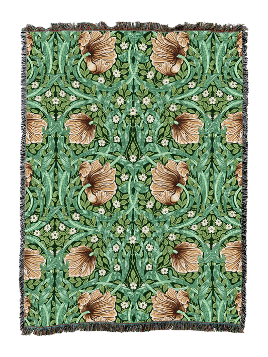Green floral blanket with fringe, featuring repeating bird silhouettes and blossoms