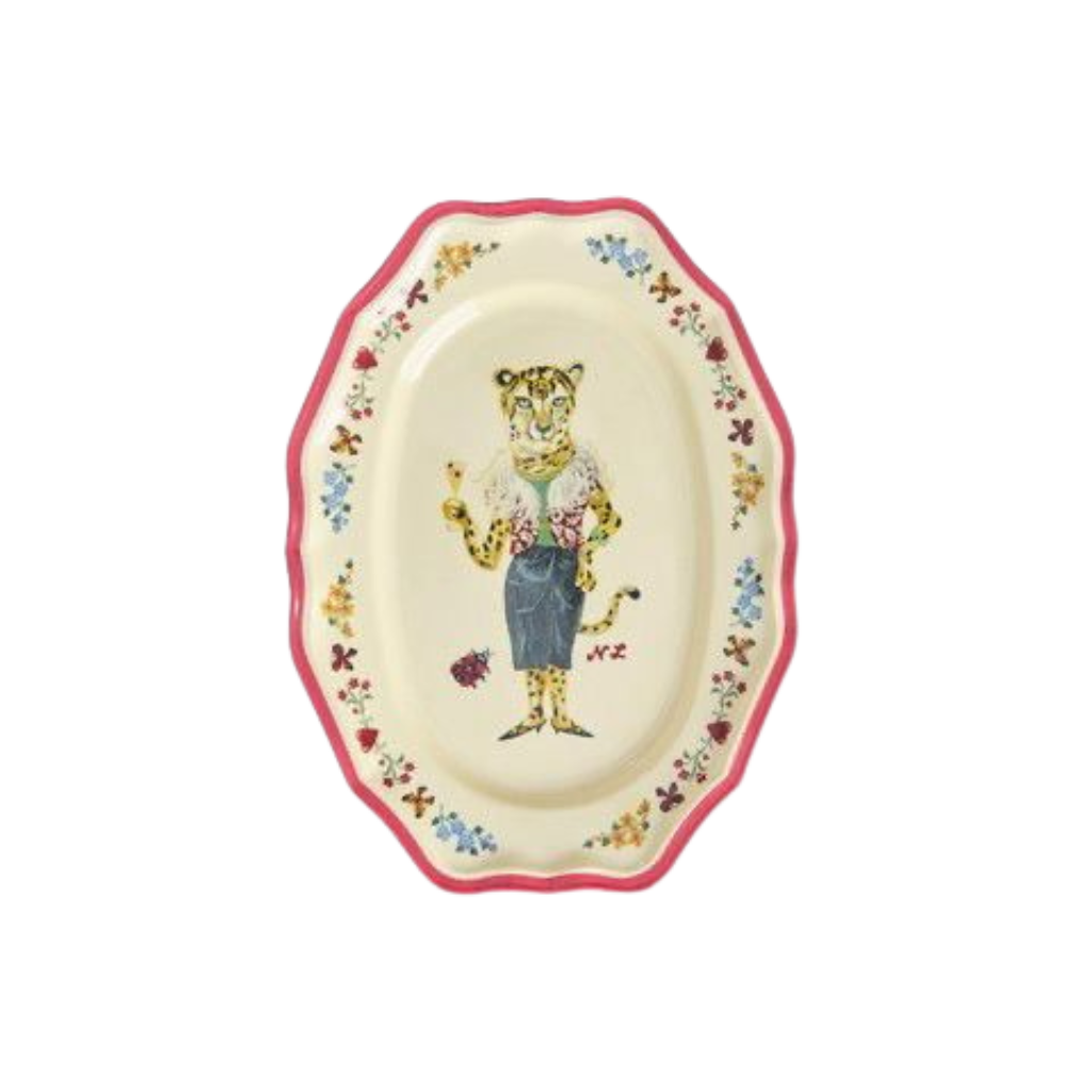 Small red melamine serving dish with octagonal rim and illustrated bear in apron