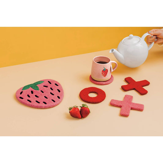 Small pink ceramic mug with red-and-green strawberry design