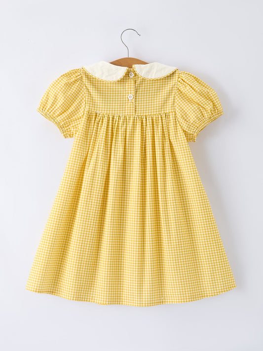 Yellow gingham dress with smocked yoke and buttoned back