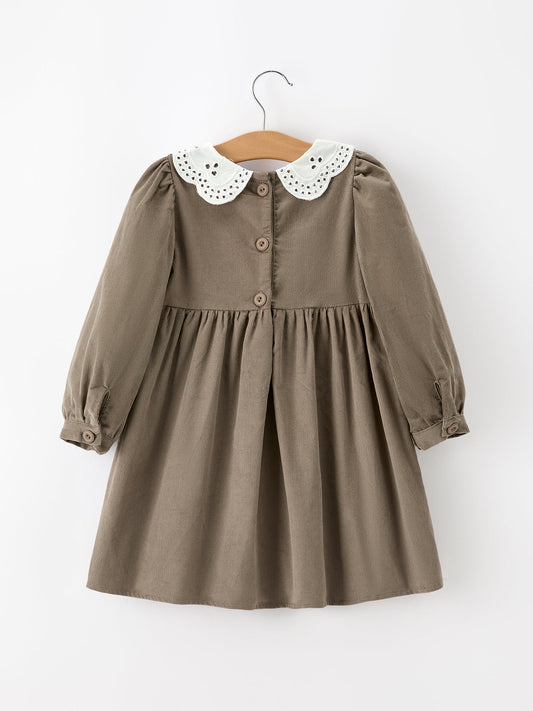 Dark olive corduroy dress with white eyelet collar and buttoned front
