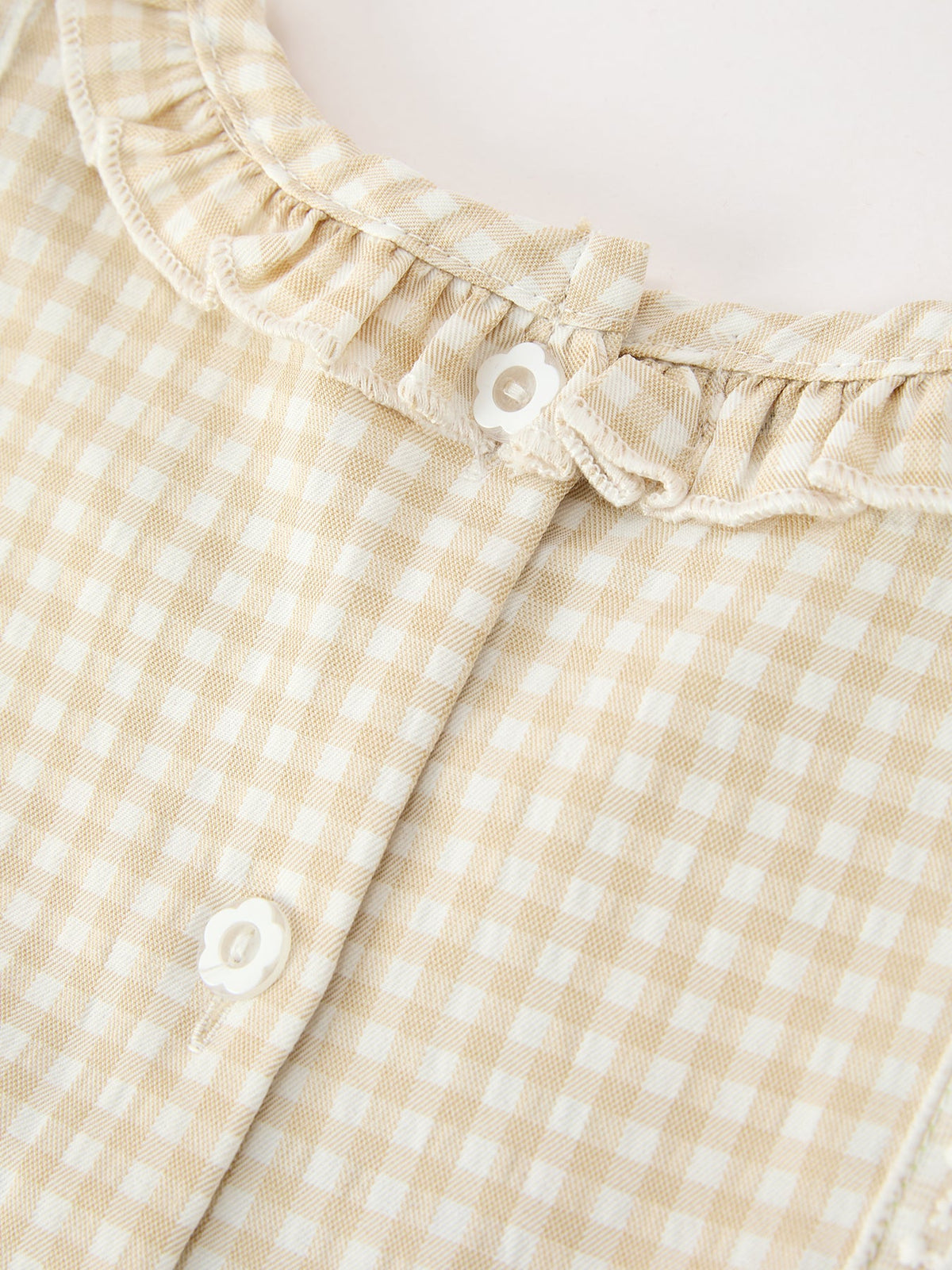 Girls beige plaid dress with ruffle neckline and button-front