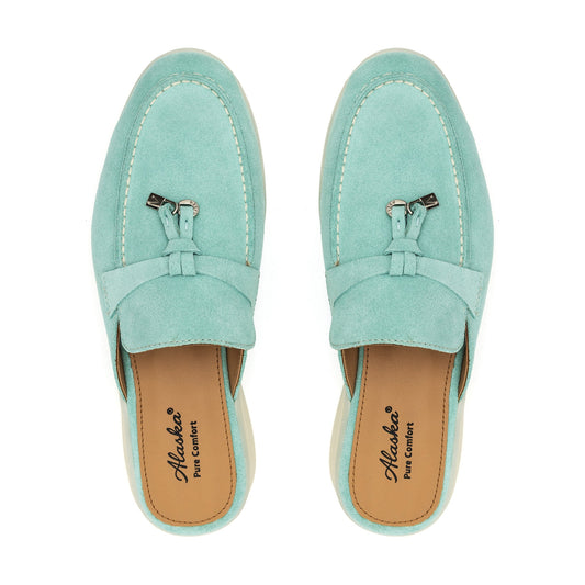 Turquoise suede mule pair with stitched moc toe and decorative metal tassels