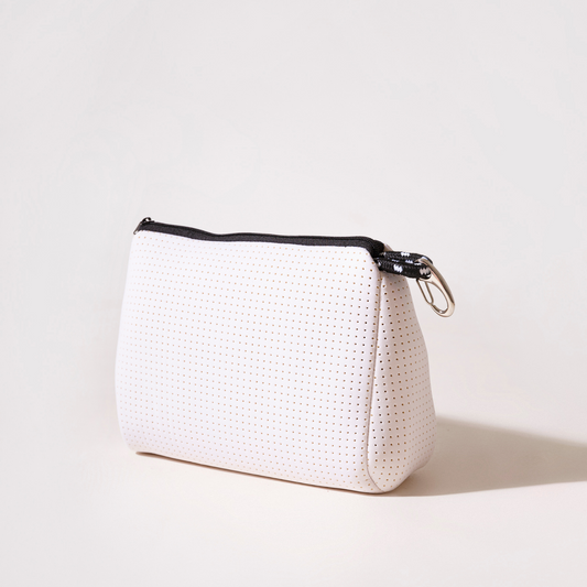 White perforated pouch with black zipper trim and metal ring side clasp