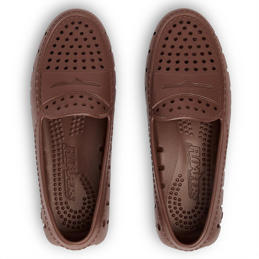 Brown slip-on clog with perforated vamp and stitched instep panel