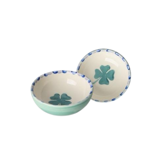 Small ceramic dipping bowls with green clover designs and blue-speckled rims