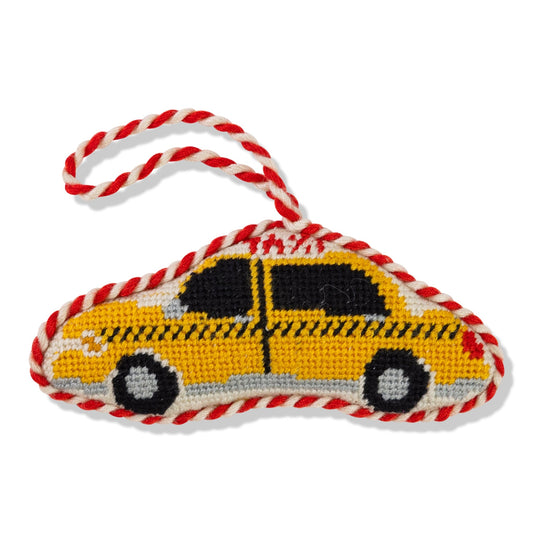 Needlepoint taxi cab ornament with red-and-white braided hanger