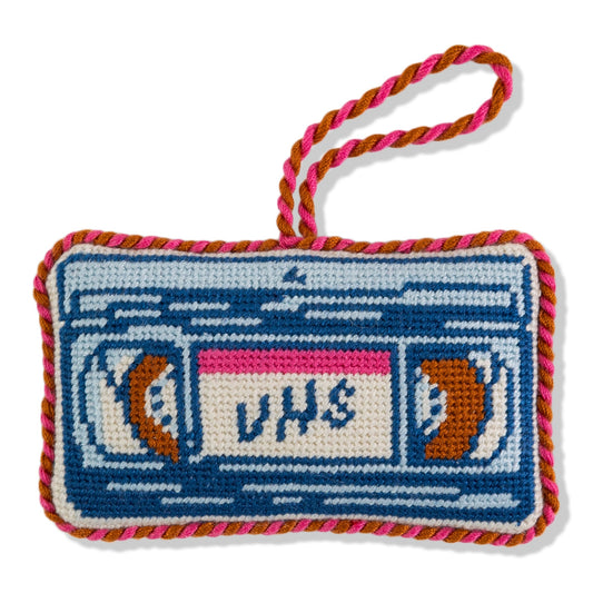 Needlepoint VHS tape ornament with braided loop, blue and white stitched design