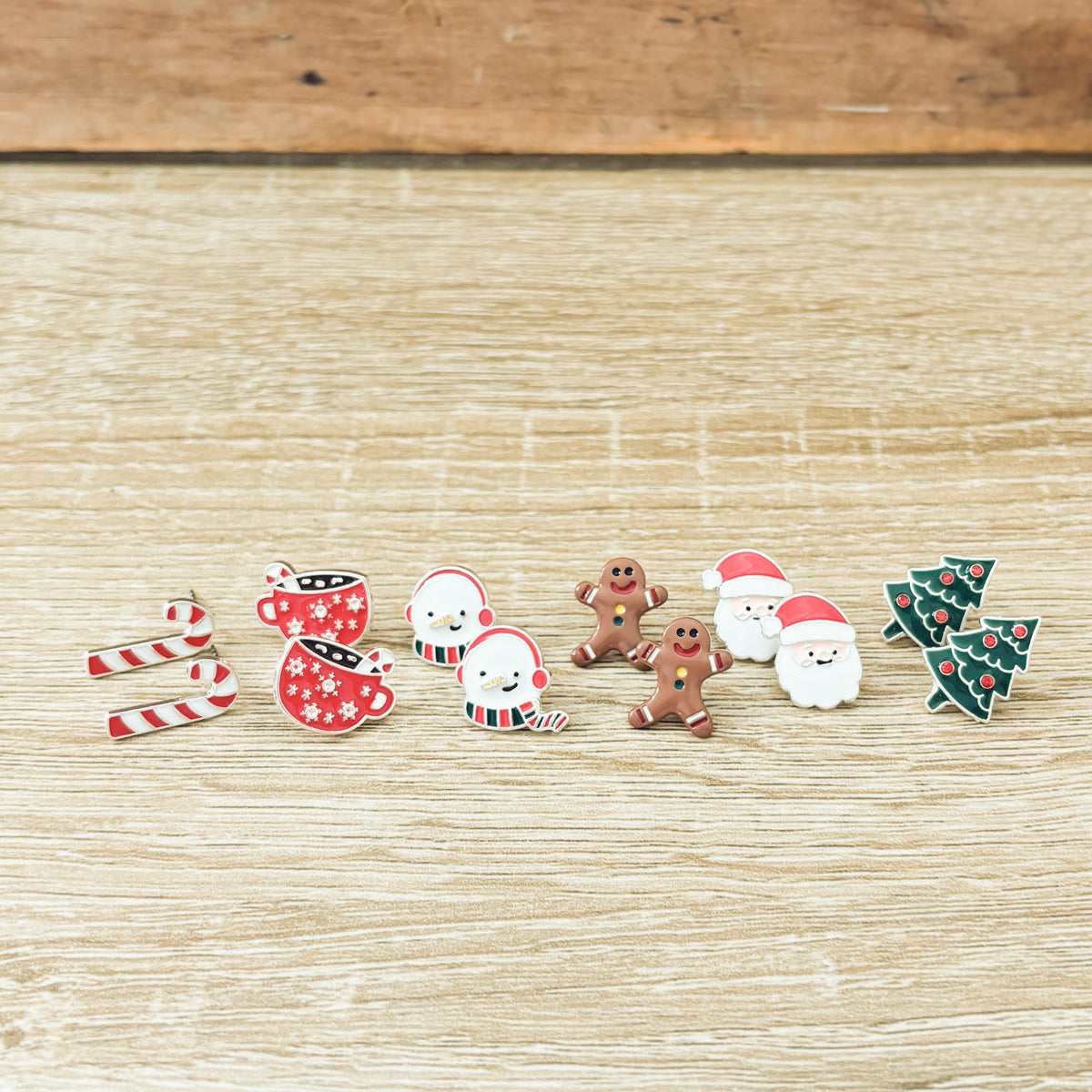 Christmas stud earring set with candy cane, gingerbread, snowmen, Santa, ornaments, and tree