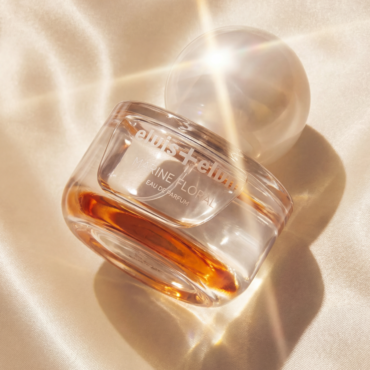 Marine floral eau de parfum close-up bottle with amber liquid and clear cap