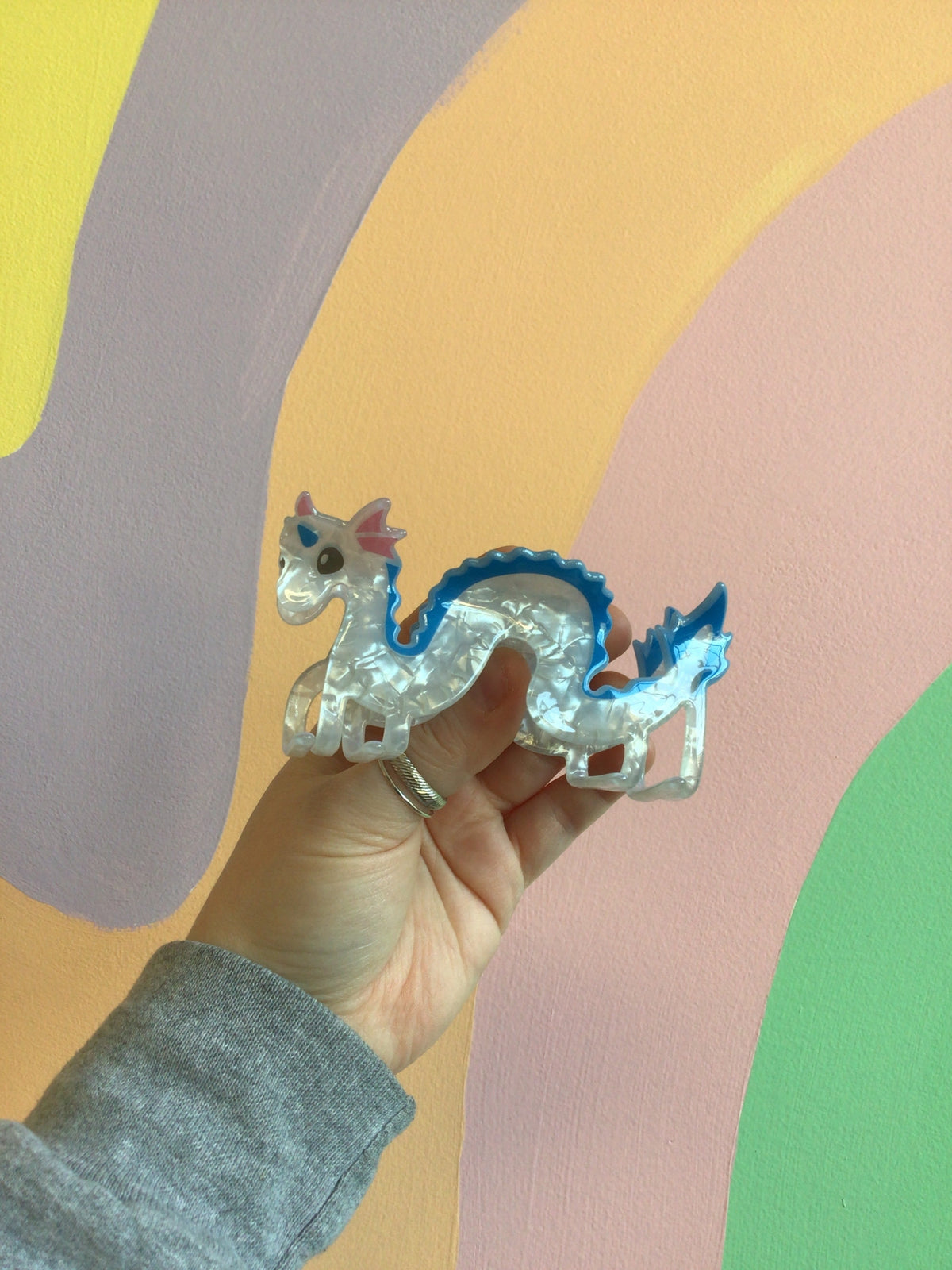 Dragon-shaped hair claw with blue and silver tones