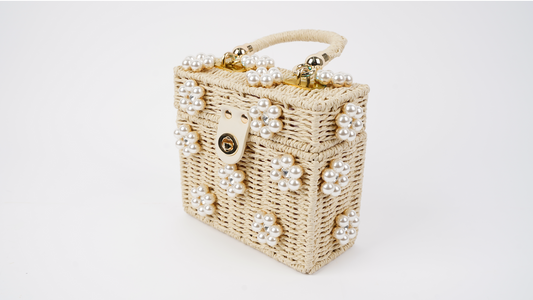 Pearl-trimmed mini straw handbag with gold-tone clasp, side view