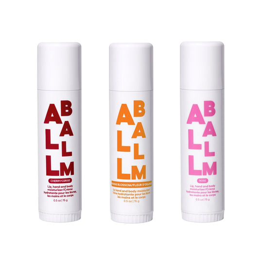 Balm stick trio with three lip balm tubes in cherry, orange blossom, and rose scents