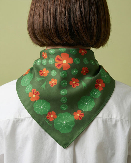 Cotton-silk bandana worn at neck, green with orange flower and leaf pattern