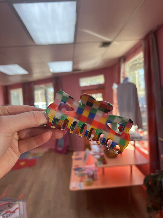 Oopsy Daisy hair claw, colorful plaid pattern with clear-style sections.