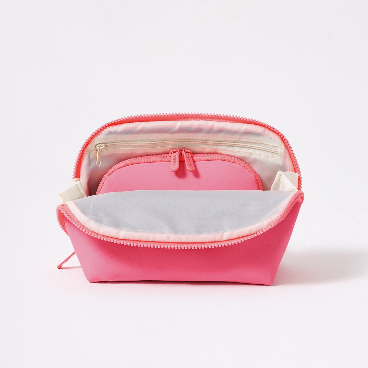 Neon pink makeup pouch set with open tops and visible inner compartments