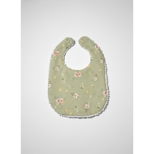 Infant linen bib with sage floral print, rounded neck opening, stitched edge trim