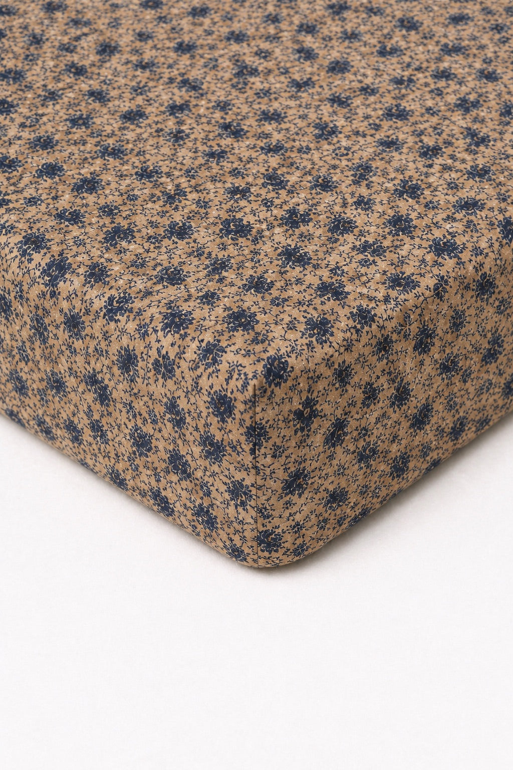 Brown and blue floral-print fitted crib sheet with an elastic corner