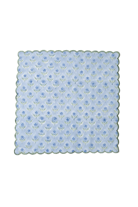Blue scallop-edge napkin with repeating embroidered floral blockprint motif