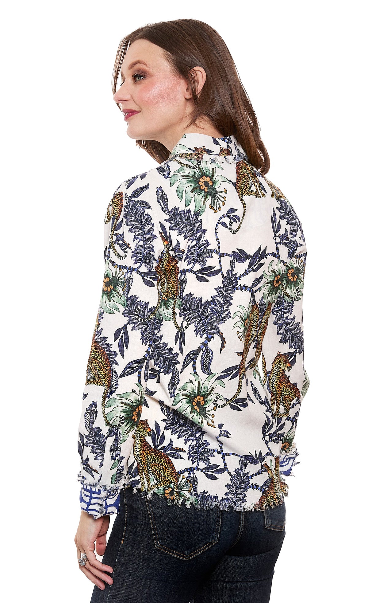 Ivory button-up top with cheetah and floral jungle print, ruffled hem and cuffs