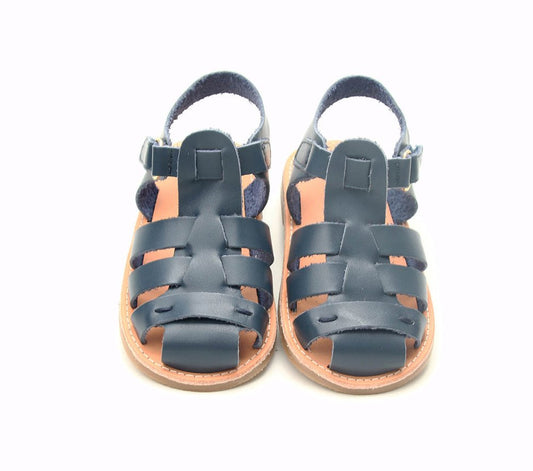 Kids' navy leather sandals with crisscross straps, buckle closure, and open toe