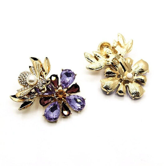 Gold-tone bee clip-on earrings with purple oval rhinestones and white pearl centers