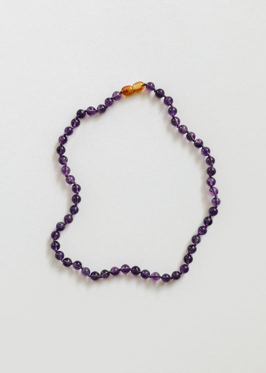 Amethyst bead necklace with purple round stones and amber accent beads