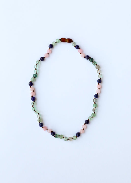 Gemstone bead necklace, oval strand with green, pink, dark blue, and amber beads