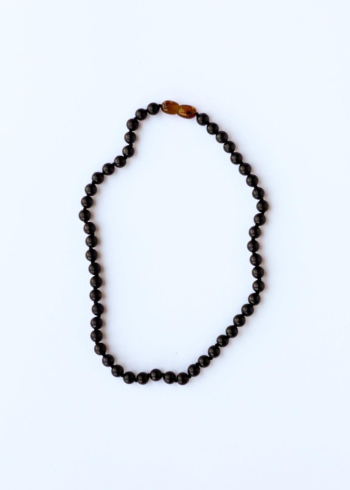 Black shungite bead bracelet or anklet with amber-toned center bead