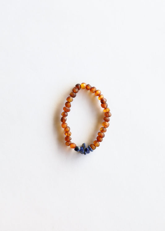 Cognac amber and lapis lazuli beaded bracelet with orange beads and blue stone accent