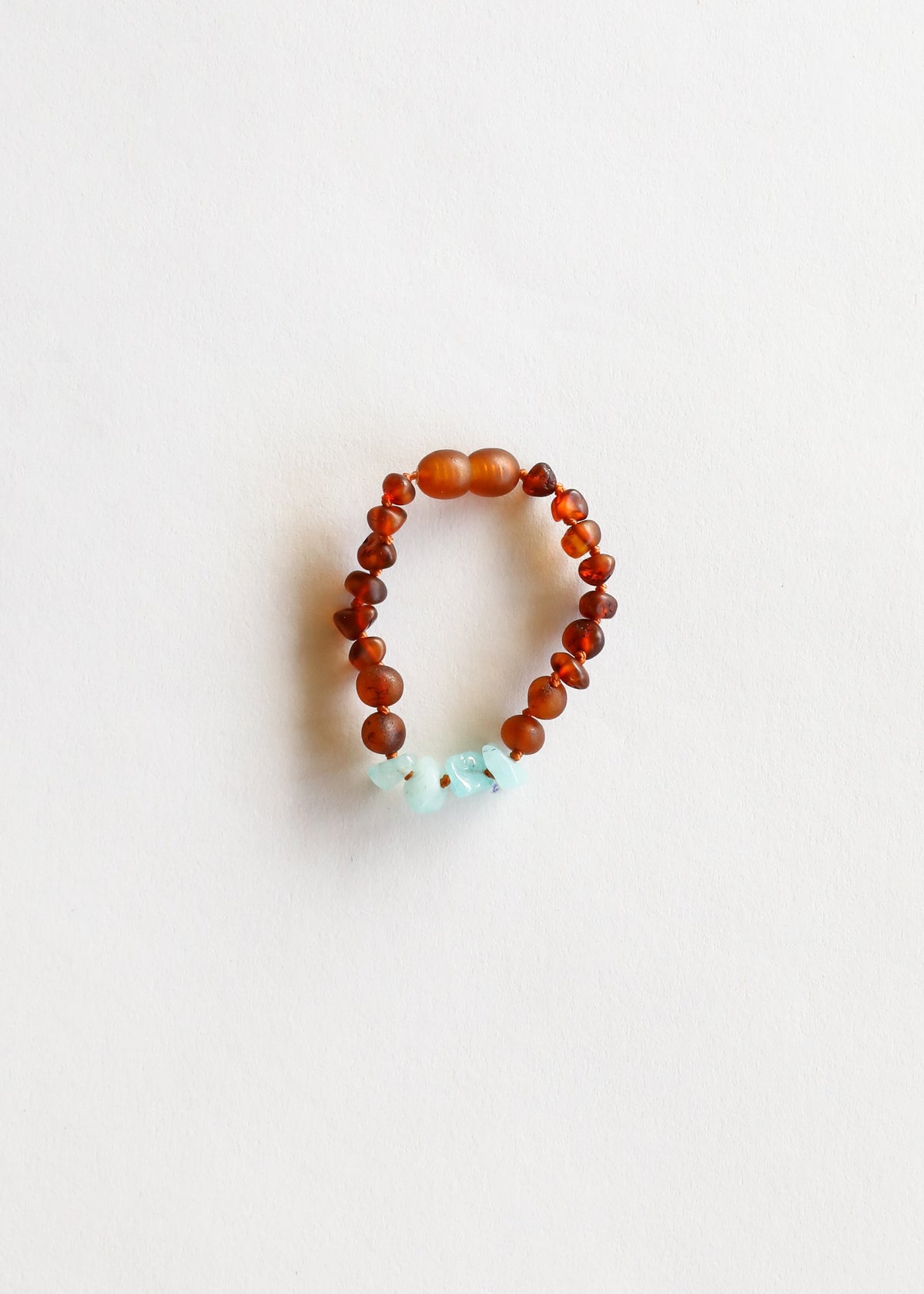 Cognac amber bead bracelet with aquamarine charm