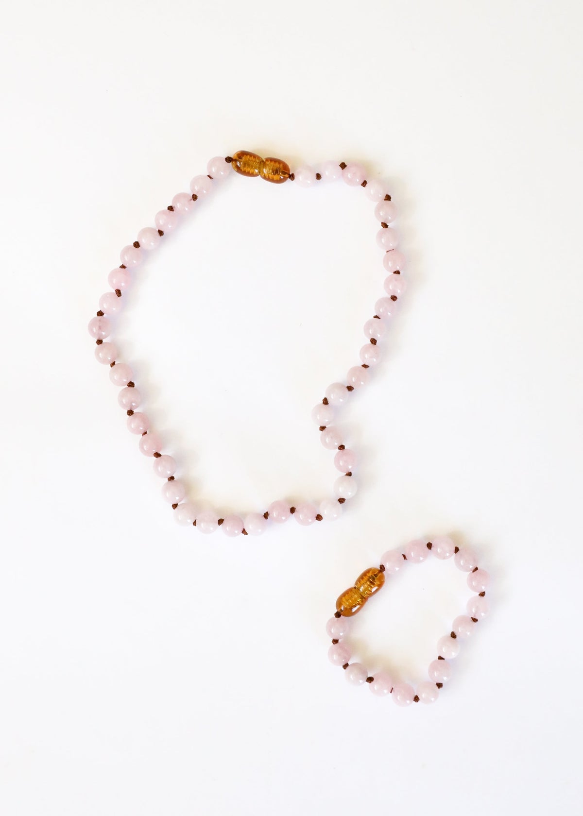 Rose quartz bead bracelet and matching anklet with gold-tone clasp beads