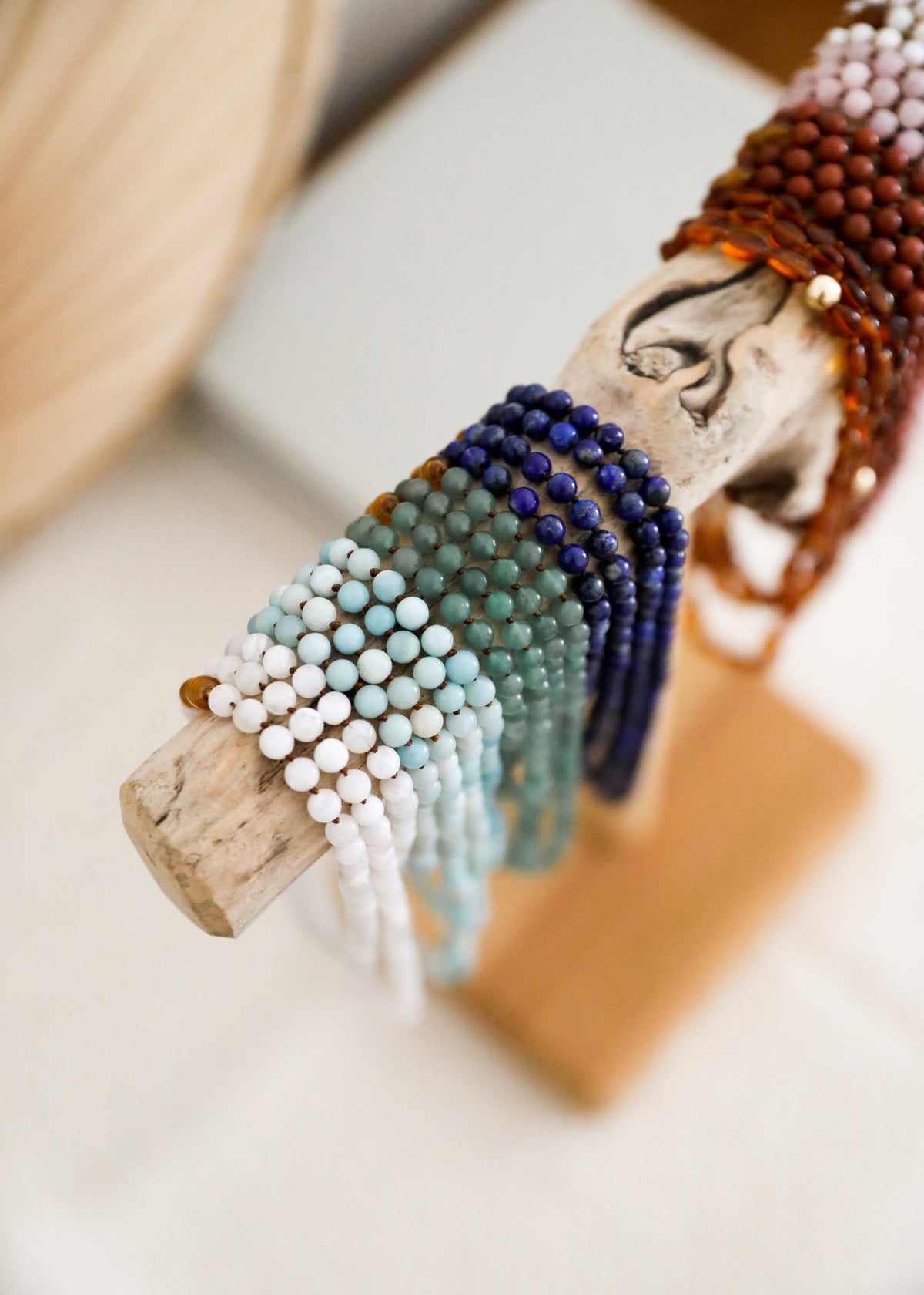 Aventurine bead charm necklace with carved wood charm and amber accent bead