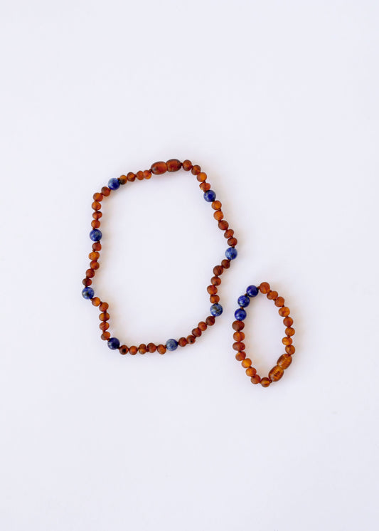Amber and lapis lazuli bead halo necklace, two oval loops with orange-brown and blue beads