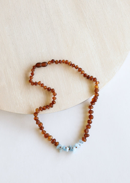 Amber bead necklace with pale blue irregular stones, beaded strand