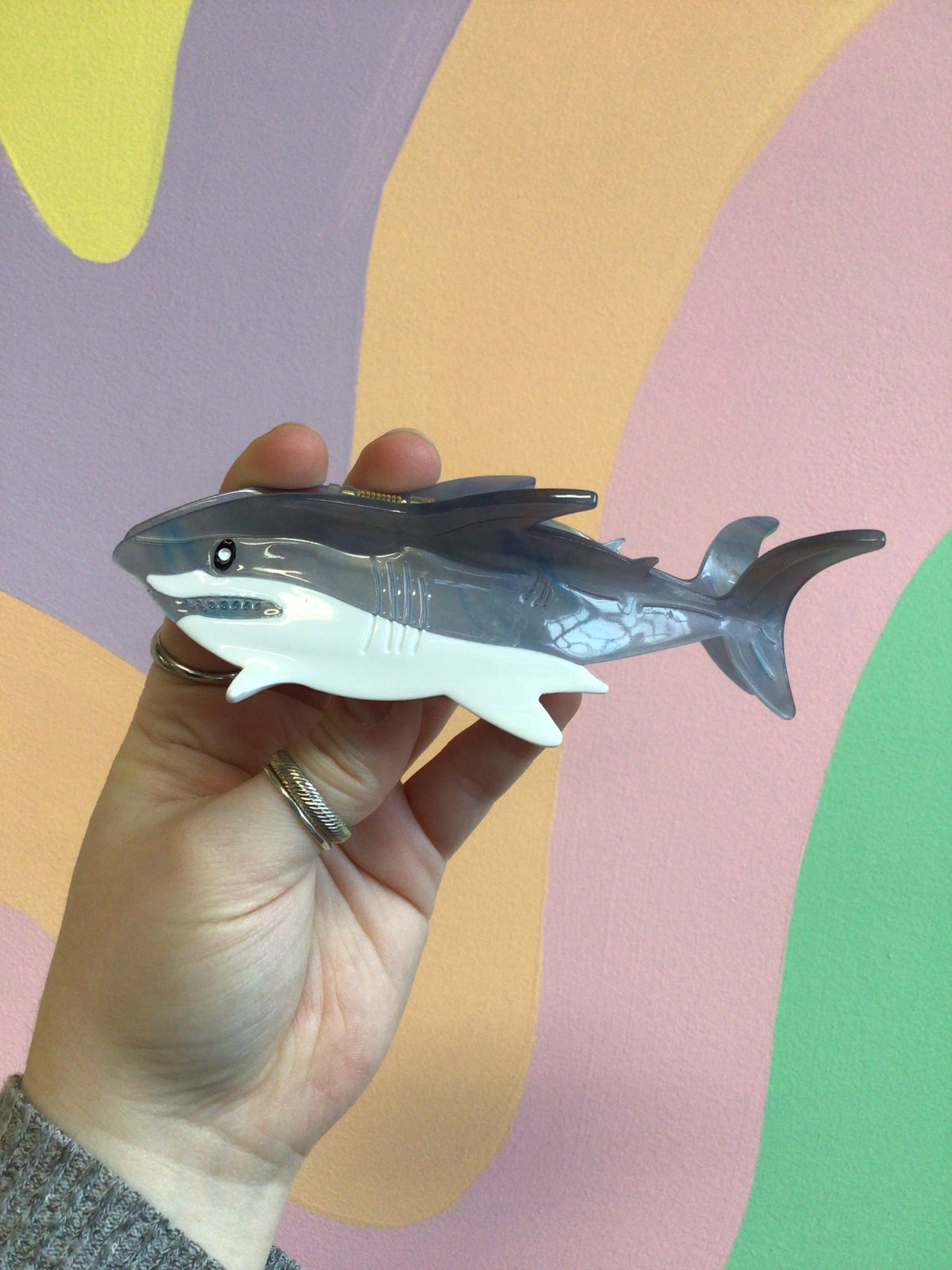 Gray shark-shaped hair claw with snap barrette