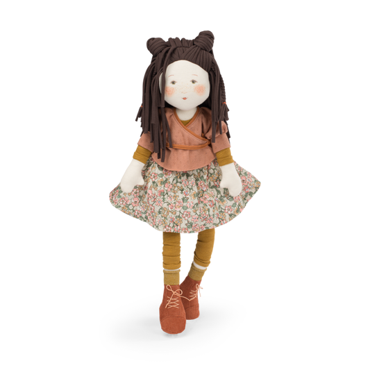 Cloth rag doll with dark brown yarn hair, terracotta top, floral skirt, brown boots