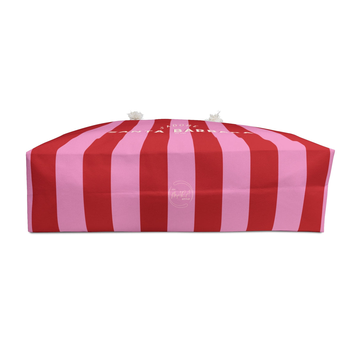 Folded striped pink and red weekender tote bag with white rope handles