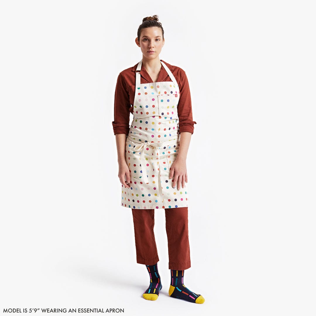 White polka-dot apron with colorful spots, adjustable neck strap and waist ties