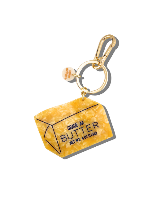 Butter bag charm keychain with gold ring and yellow butter package tag