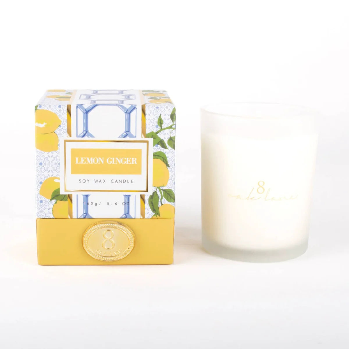 Boxed 5.6 oz soy wax candle with lemon ginger label and frosted white glass jar