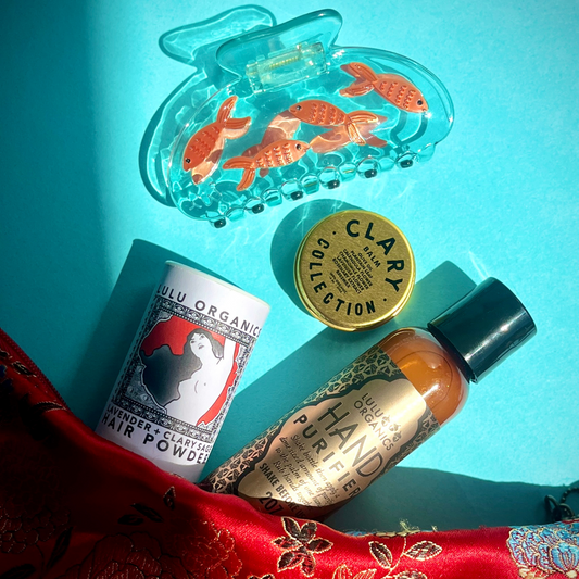 Fish-themed hair claw with orange goldfish inside clear blue resin