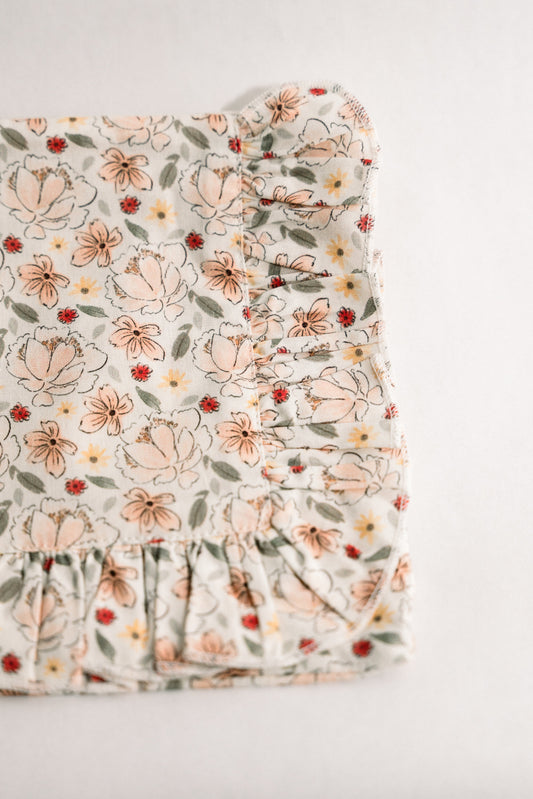 Primrose Garden floral ruffle zipper pouch closeup, cream with Petite Bouquet print