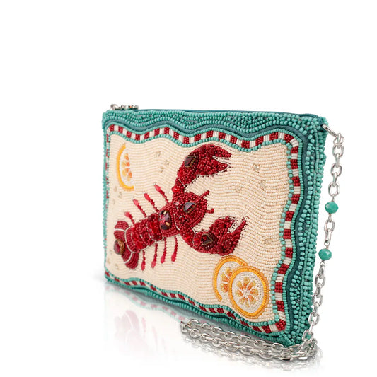 Beaded lobster handbag with teal beaded border, cream panel with red lobster and chain strap