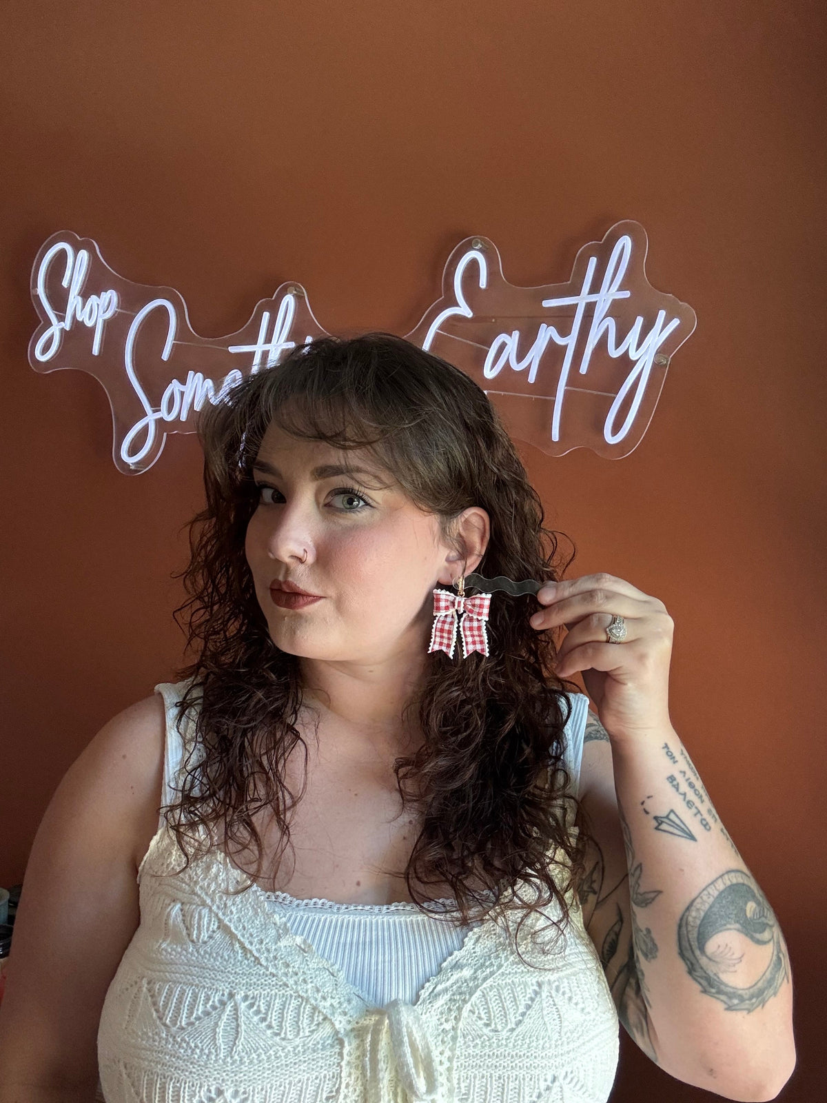 Red gingham bow earrings on gold hoop hardware