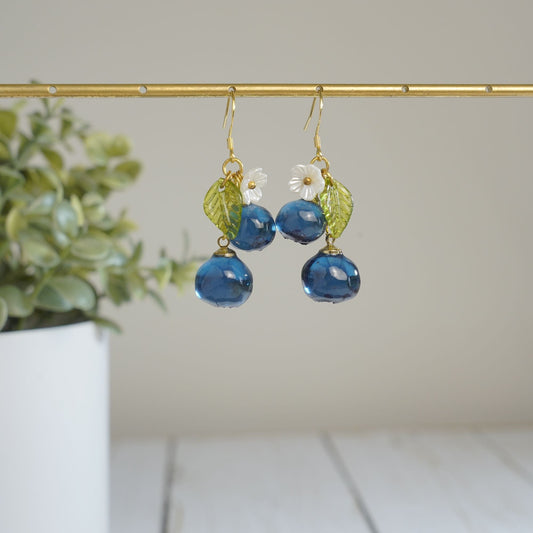 Blueberry cluster dangle earrings with blue resin berries, green leaves, white flowers, gold hooks